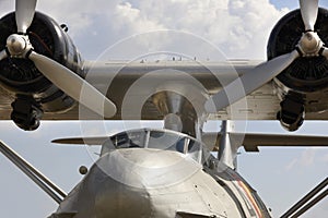Huge hydroplane wings and propeller engines with blue sky background