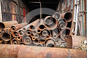 Huge industrial rusted iron metal tubes pipes