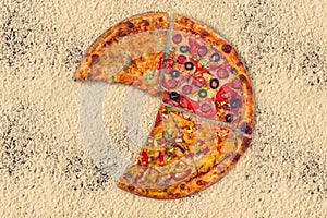 Huge international pizza on flour background