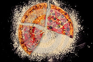 Huge international pizza on flour background