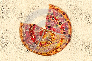 Huge international pizza on flour background