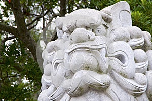 Huge Komainu dog-lion like guardian stone statue Izanagi Shrine on Awaji Island in Japan