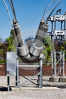 Huge Lightning Arrestors and or Insulators at Power Plant Protecting Lines