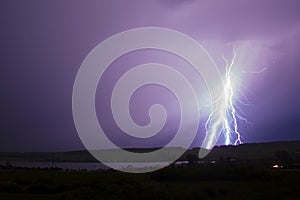 Huge lightning strikes the forest and field