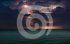 Huge lightnings in dark stormy sky above waving sea