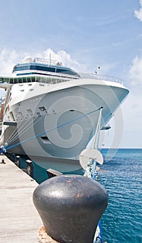 Huge Luxury Cruise Ship Tied to Black Bollard