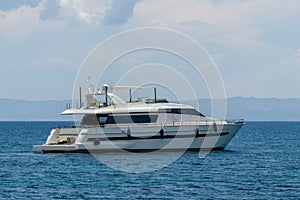 Huge luxury motor yacht cruising in a calm ocean
