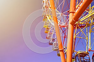 Huge modern colorful bright ferris wheel in an amusement park