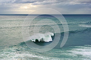 Huge ocean wave breaking in Nazare, Portugal