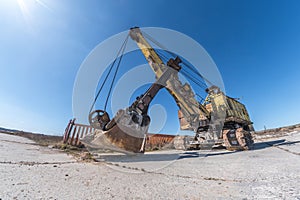 Huge old rusty abandoned mining excavator