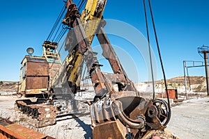 Huge old rusty abandoned mining excavator