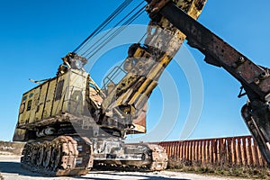 Huge old rusty abandoned mining excavator