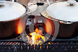 huge pans with hot mulled wine at christmas festive. outdoors. new year 2020 concept