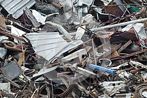 Huge pile of scrap metal waste on recycling yard