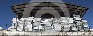 Huge piles of refrigerators stacked at recycling plant