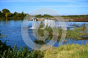 Aerator to enrich the pond with oxygen, a huge pipe c with holes