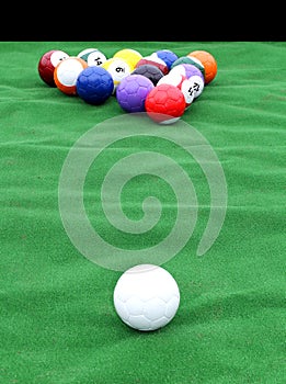 Huge pool table with soccer balls instead of the billiard balls