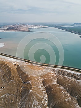 Huge potassium salt and sand piles, aerial landscape.