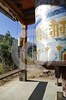 Huge prayer wheel repeating mantra