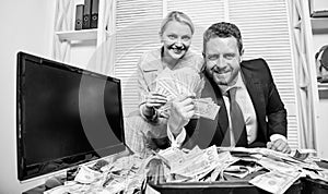 Huge profit concept. Counting money profit. Financial success. Man businessman and woman secretary with pile dollar