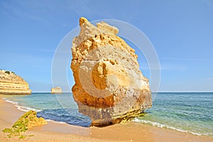 Huge rock at the cliff beach of Praia da Marinha, lovely hidden beach near Lagoa Algarve Portugal