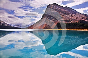 The huge rock in emerald waters