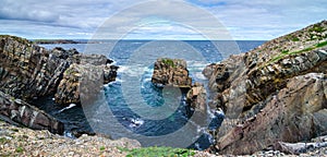 Huge rocks and boulder outcrops along Cape Bonavista coastline in Newfoundland, Canada.