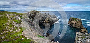 Huge rocks and boulder outcrops along Cape Bonavista coastline in Newfoundland, Canada.