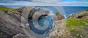 Huge rocks and boulder outcrops along Cape Bonavista coastline in Newfoundland, Canada.