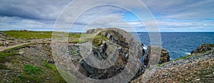 Huge rocks and boulder outcrops along Cape Bonavista coastline in Newfoundland, Canada.