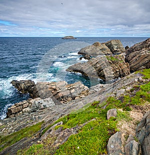 Huge rocks and boulder outcrops along Cape Bonavista coastline in Newfoundland, Canada.