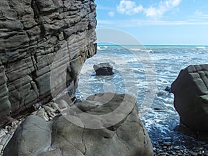 Huge rocks and the sea.