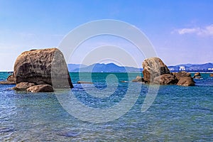 Huge rocks on the shore of the South China Sea in the World's End park. Sanya, China