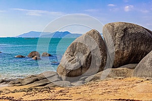 Huge rocks on the shore of the South China Sea in the World's End park. Sanya, China