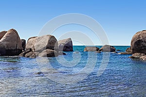 Huge rocks on the shore of the South China Sea in the World's End park. Sanya, China