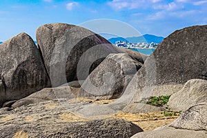 Huge rocks on the shore of the South China Sea in the World's End park. Sanya, China