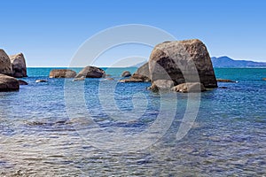 Huge rocks on the shore of the South China Sea in the World's End park. Sanya, China