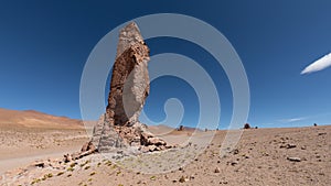A huge rocky aristocracy rises up on a flat plain of red sand in the Atacama Desert, the so-called Monks of the Pacana