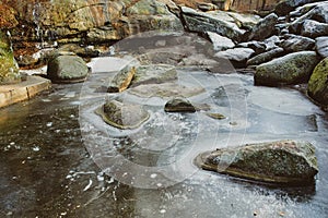 Huge round frozen stones in winter