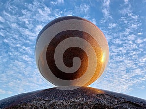 A huge round stone miraculously keeps balance