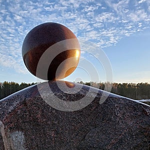 A huge round stone miraculously keeps balance