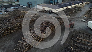 a huge sawmill with a lot of logs. 4k drone footage