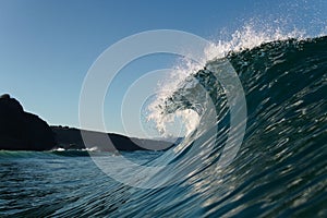 Huge sea wave breaking beach