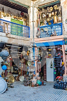 Huge selection of pots, lamps, lantern and other metal works in shop of souk in medina of Fez, Morocco, North Africa