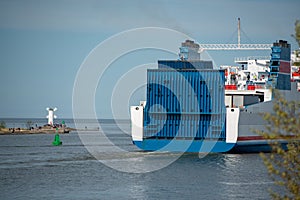 A huge ship a passenger ferry goes out to baltic sea. Leaving port in Swinoujscie, Poland. The purpose of the trip is the port in