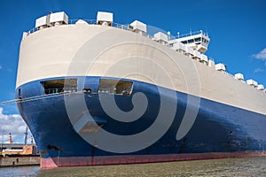 Huge ship for the transport of cars lies in a port