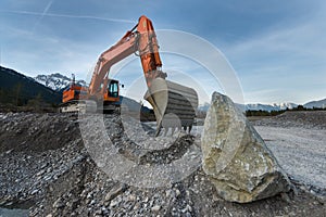 Huge shovel excavator standing on gravel