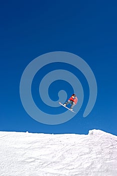 Huge snowboarding jump on slopes of ski resort in Spain