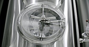 Huge stainless vats in a brewery. Equipment for beer fermentation. Factory