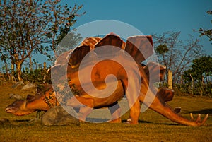Huge statue of a dinosaur. Prehistoric animal models, sculptures in the valley Of the national Park in Baconao, Cuba.